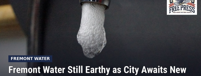Fostoria News: Water running from a kitchen faucet, with headline: Fremont Water Still Earthy as City Awaits New MIB Results